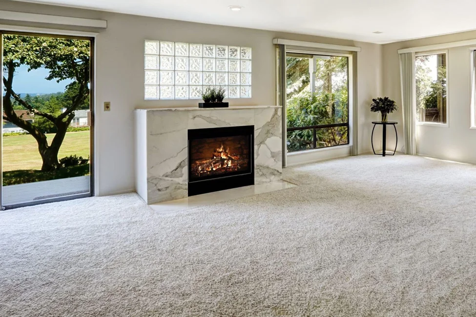 carpet flooring in spacious living room with fireplace